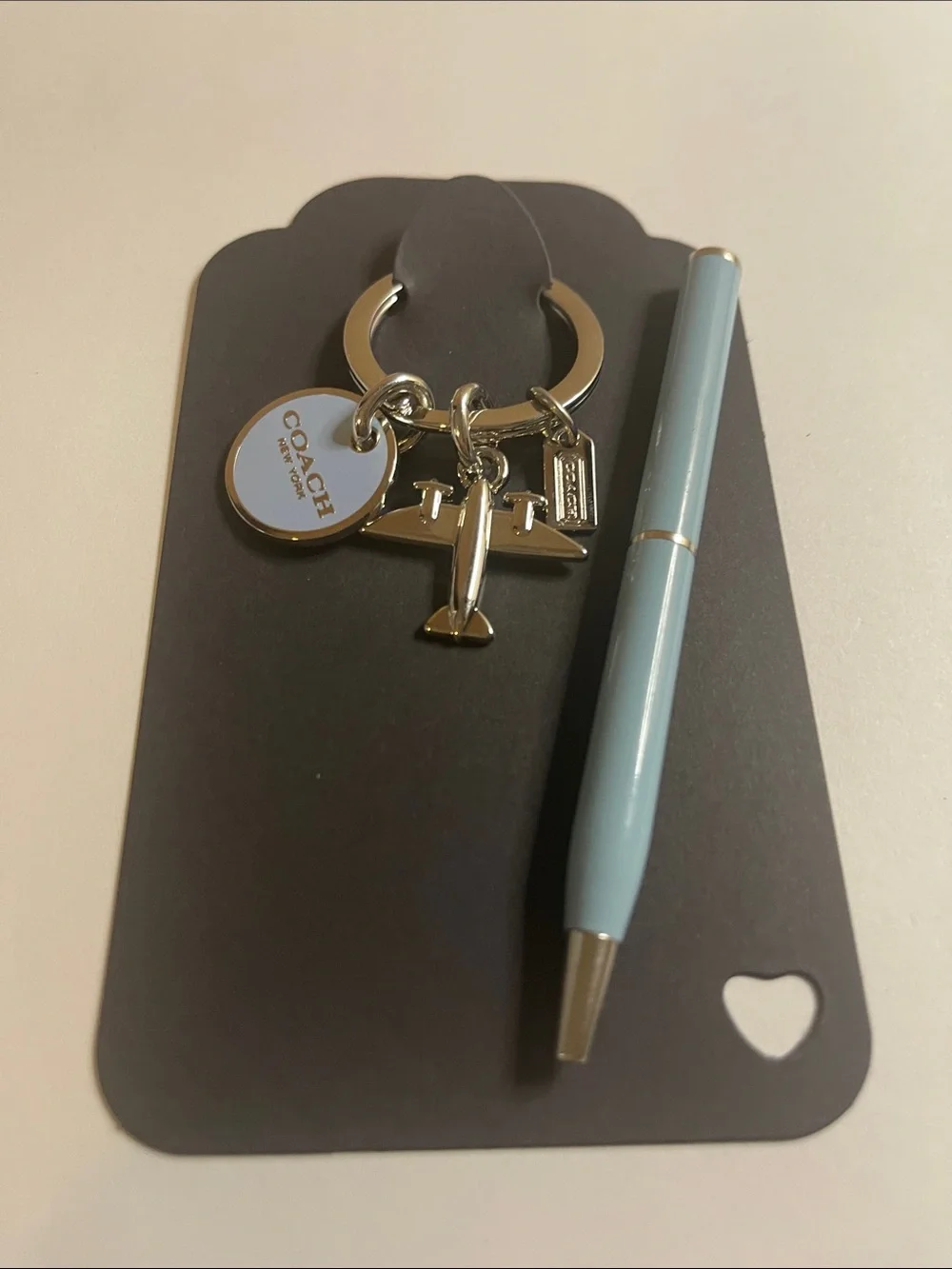 Coach Silver Airplane Keyring with Light Blue Round Charm and Coach Pen